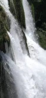 Cascading waterfall amid lush green scenery on a mobile wallpaper.