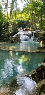 Serene waterfall with lush greenery in mobile wallpaper.