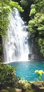 Serene waterfall cascading into a teal blue pool surrounded by lush greenery.