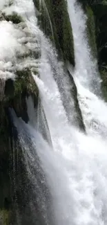 Majestic waterfall cascading through lush greenery, perfect for mobile wallpaper.