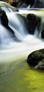 Serene waterfall with lush greenery in a mobile wallpaper.