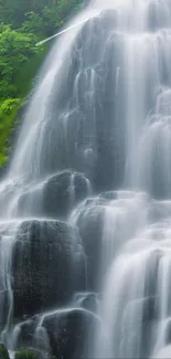 Serene waterfall with cascading water and lush green foliage