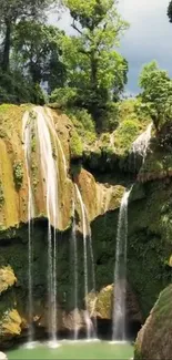 Lush green waterfall cascading into a serene pool.