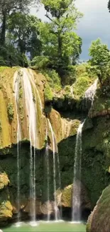 A serene waterfall with lush green foliage, perfect for a calming phone wallpaper.