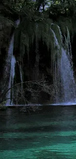 Serene waterfall with lush greenery and emerald waters