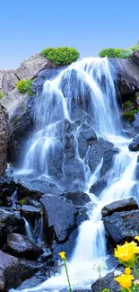 Cascading waterfall and vibrant greenery scenic wallpaper.