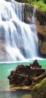 Serene turquoise waterfall surrounded by lush greenery.