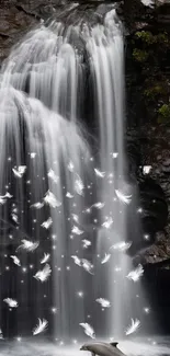 Majestic waterfall with glowing feathers creating a serene ambiance.