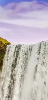 A serene waterfall cascades with a rainbow in the sky, offering a tranquil view.