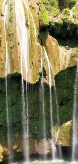 Lush green landscape with cascading waterfalls.