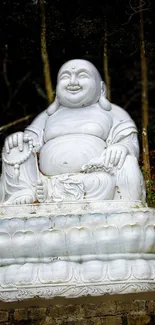 Majestic white Buddha statue amidst lush forest scenery.