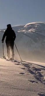 A lone skier traverses a snowy mountain path under a clear sky.