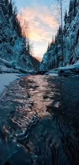 Winter stream flowing under vibrant sunset sky.