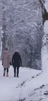 Two people walking in a snowy forest scene.