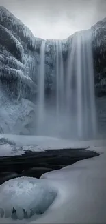 Serene winter waterfall with snow and ice.