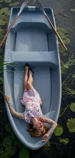 Woman relaxing in a blue boat surrounded by green water lilies.