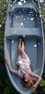 Woman lying in blue boat with lily pads.