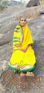 Woman in yellow saree in serene landscape, peaceful setting.