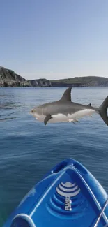 Kayak with a shark in blue ocean under clear sky.