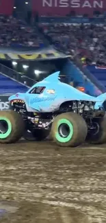 Shark-themed monster truck in action during an intense arena event.