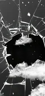 Shattered glass with clouds background wallpaper.