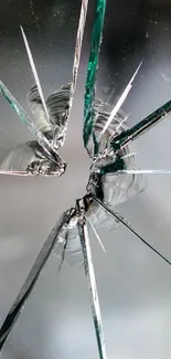 Close-up of shattered glass design on mobile wallpaper.