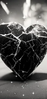 Artistic black cracked heart wallpaper design.