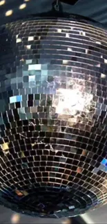 Shining disco ball wallpaper with reflective tiles.