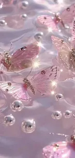 Pink butterflies floating on reflective water creating a serene aesthetic.