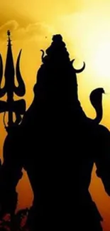 Silhouette of Lord Shiva against an orange sunset.