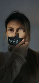 Woman with taped mouth, speaking silence theme.