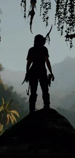 Silhouette of adventurer in jungle landscape with mountains.