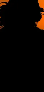 Silhouette of a person against an orange sunset on mobile wallpaper.