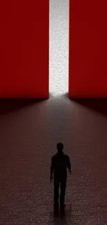 Silhouette stands in front of a bright red light, creating a striking contrast.