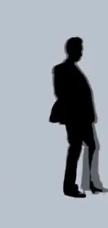 Silhouette of a person on a light gray background wallpaper.