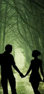 Silhouette of a couple walking in a green forest path wallpaper.