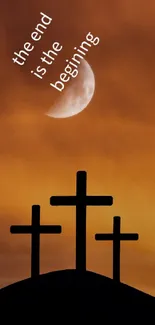 Silhouette of three crosses against an orange sky at dawn, symbolizing new beginnings.