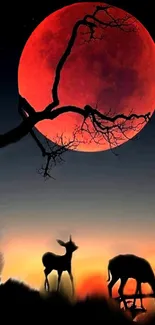 Deer silhouette under a red moon in a mystical night scene.