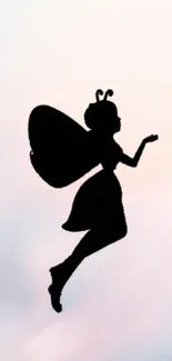 Silhouette of a fairy in front of a light pink sky on mobile wallpaper.