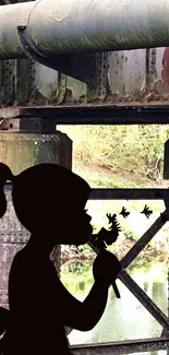 Silhouette of a girl with dandelions under an old iron bridge.