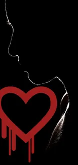 Silhouette of a person with a dripping red heart on black background.