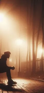 Silhouette on park bench in foggy evening light with street lamps.