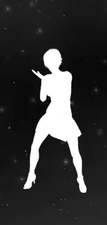 White silhouette dancing on black starry night background.