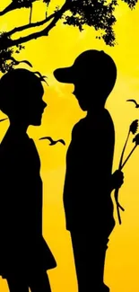 Silhouette of kids in love under tree, vibrant yellow background.