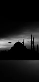 Silhouette of a mosque against a sunset sky, creating a tranquil and elegant wallpaper.