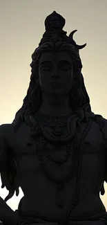 Silhouette of Lord Shiva against the sky, providing a calming spiritual aura.