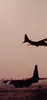 Silhouette of military aircraft in sunset sky.