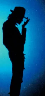 Silhouette figure against a blue background.