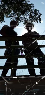 Silhouette of people on a bridge with a bright blue sky and tree shadows.