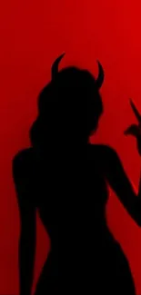 Silhouette with horns on vibrant red background.